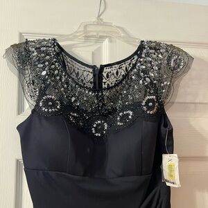 NWT Black Xscape knee length dress with beaded neckline